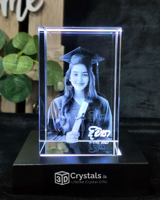 Graduation-themed crystal with a person in a cap and gown, held by a scroll, on a dark background with '3D Crystals' branding.